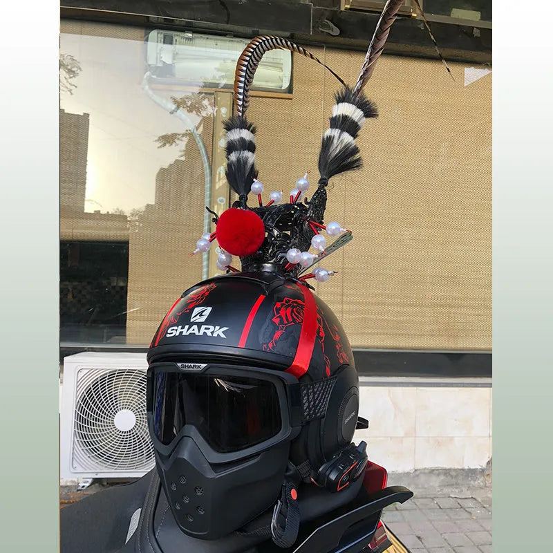 Zijin Crown gold motorcycle helmet feather ornament with long black plume attached to a black helmet.