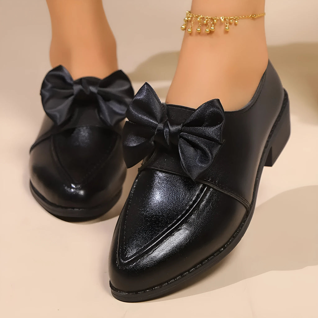 Women's simple leather shoes with a pointed toe and a choice of big bow or small bowknot detail.