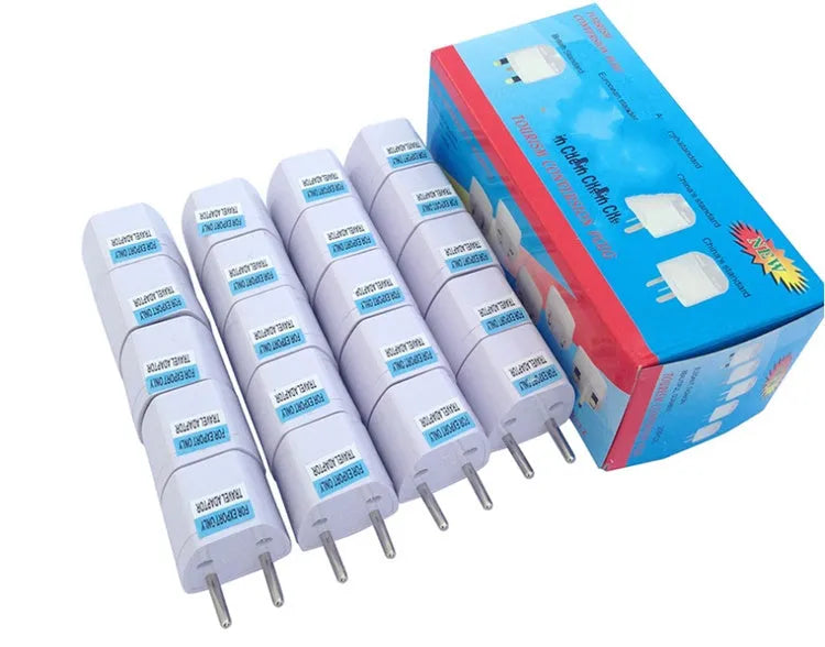 Multi country conversion plug in white with AU EU German UK and US style options on a neutral background