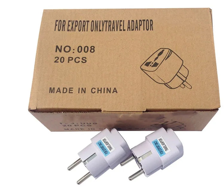 Multi country conversion plug in white with AU EU German UK and US style options on a neutral background