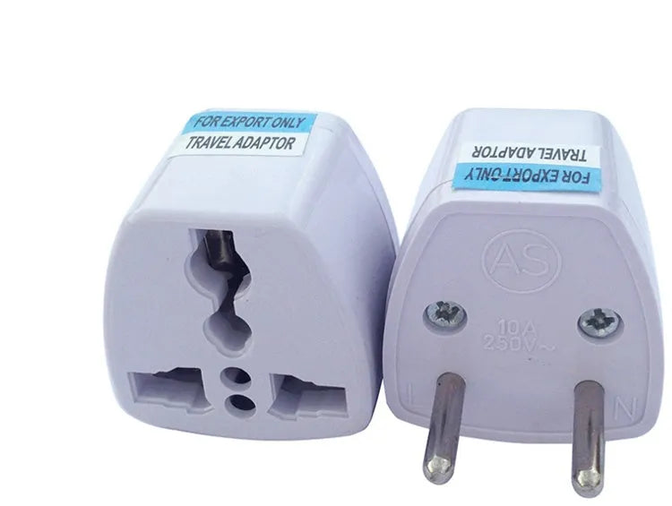 Multi country conversion plug in white with AU EU German UK and US style options on a neutral background
