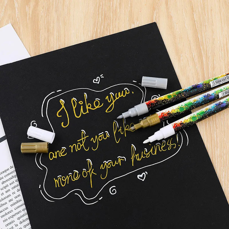 Set of six colourful acrylic graffiti marker pens with 0.7mm tips in a plastic box.