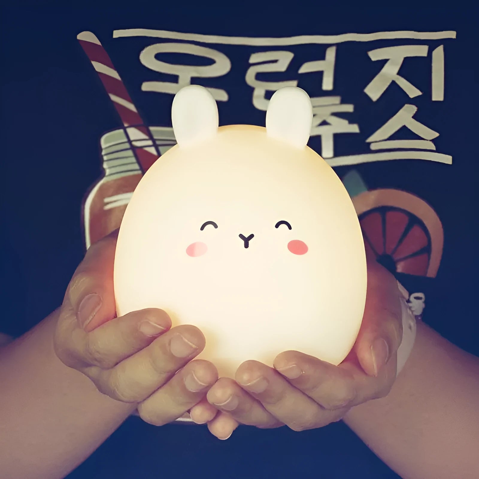 Silicone cute rabbit rechargeable night light with LED glow on bedside table