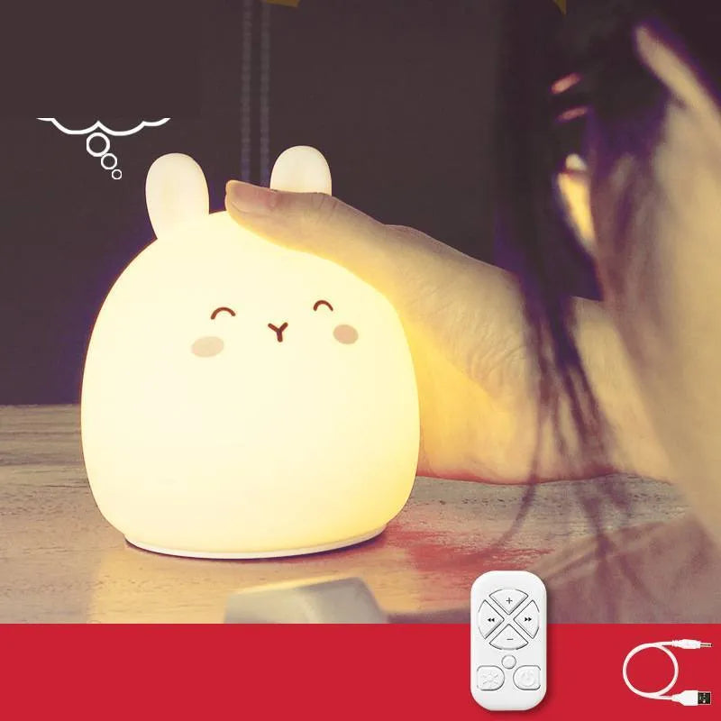 Silicone cute rabbit rechargeable night light with LED glow on bedside table
