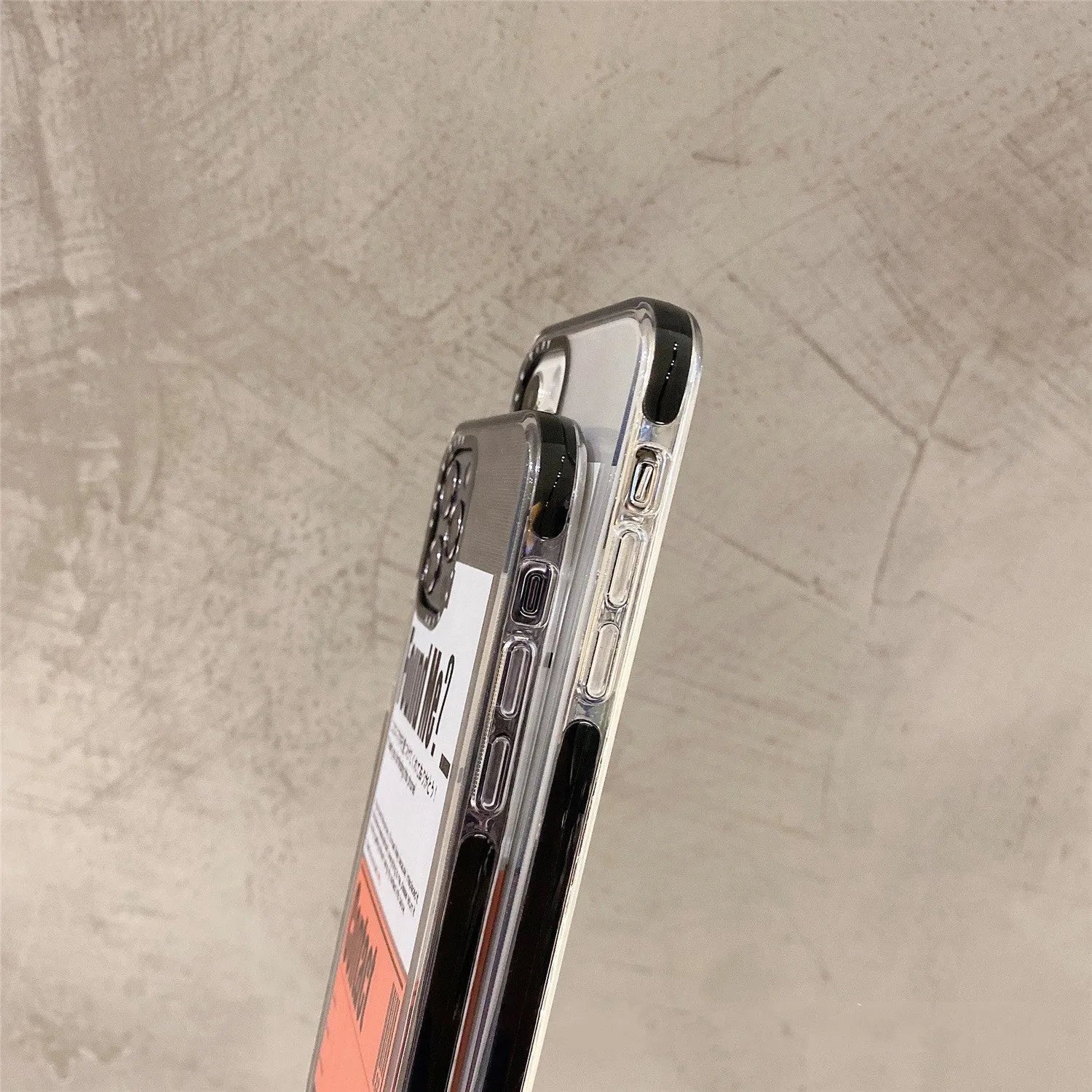 Transparent iPhone case with orange sticker decoration on clear plastic back