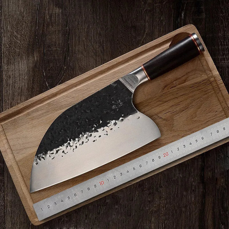 Kitchen chef's knife with stainless steel blade and ebony wood handle for cutting meat and bones.