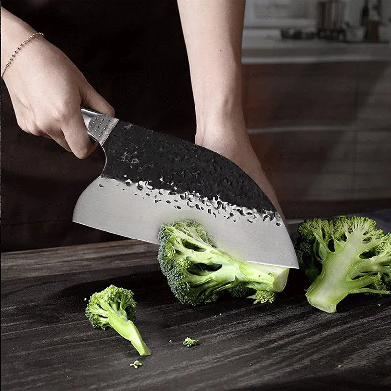 Kitchen chef's knife with stainless steel blade and ebony wood handle for cutting meat and bones.