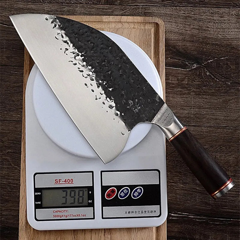 Kitchen chef's knife with stainless steel blade and ebony wood handle for cutting meat and bones.
