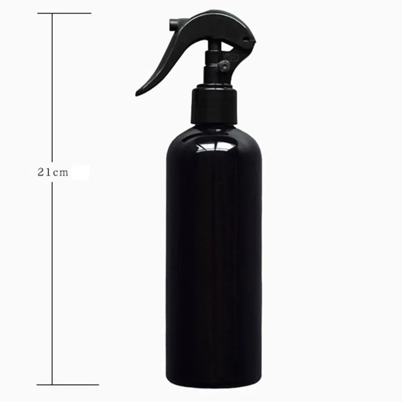 16-piece black mini garden tool set for succulents arranged on a 75cm square cushion mat, includes watering bottles, tweezers, and small shovel.