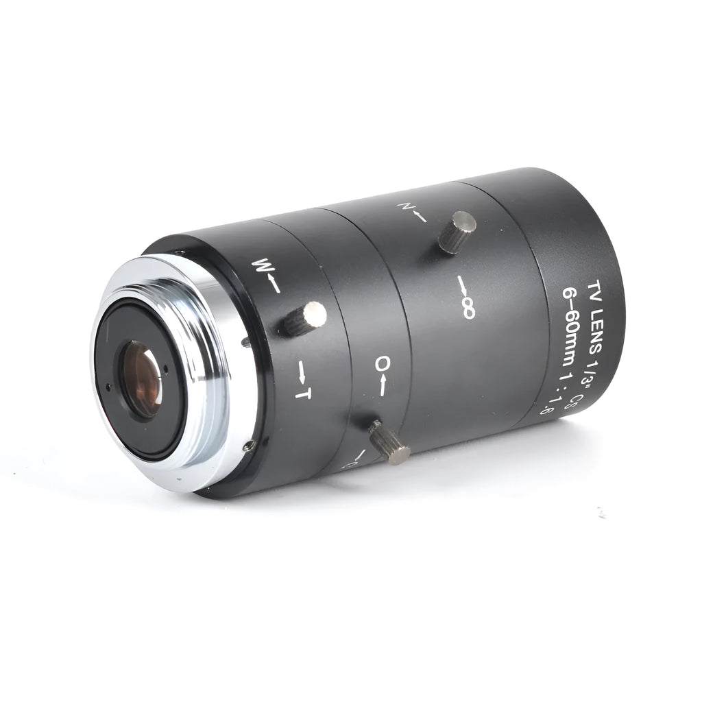 Black manual aperture 6-60mm CS mount CCTV camera lens on a flat surface.