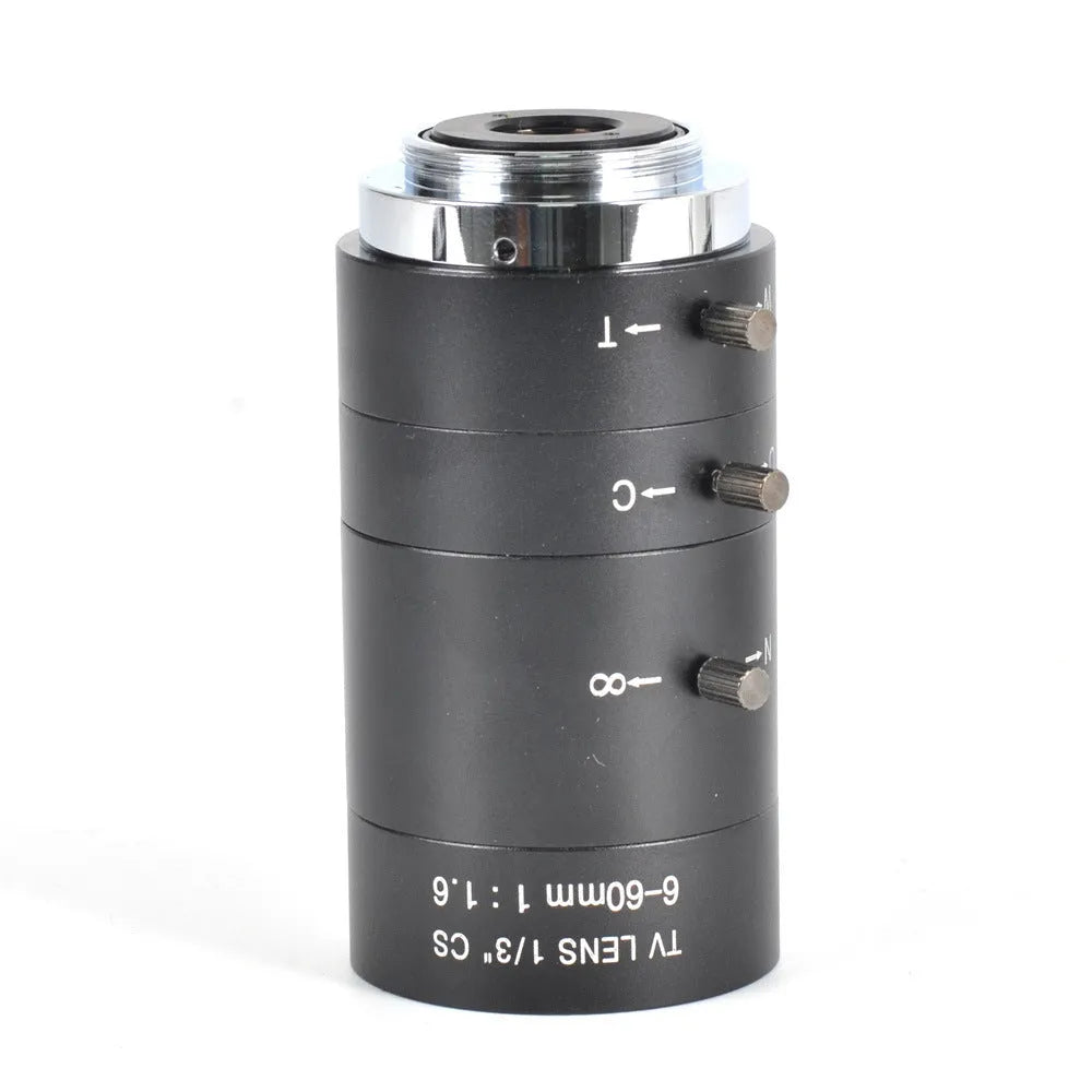 Black manual aperture 6-60mm CS mount CCTV camera lens on a flat surface.