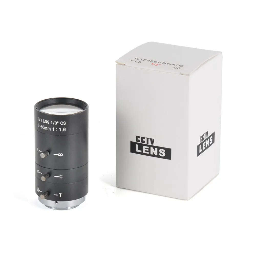 Black manual aperture 6-60mm CS mount CCTV camera lens on a flat surface.
