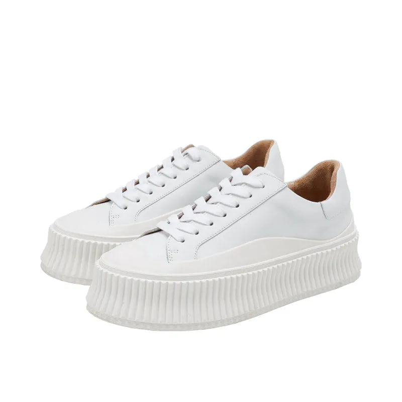 Women's black suede platform sneakers with thick 4cm sole and back lacing.