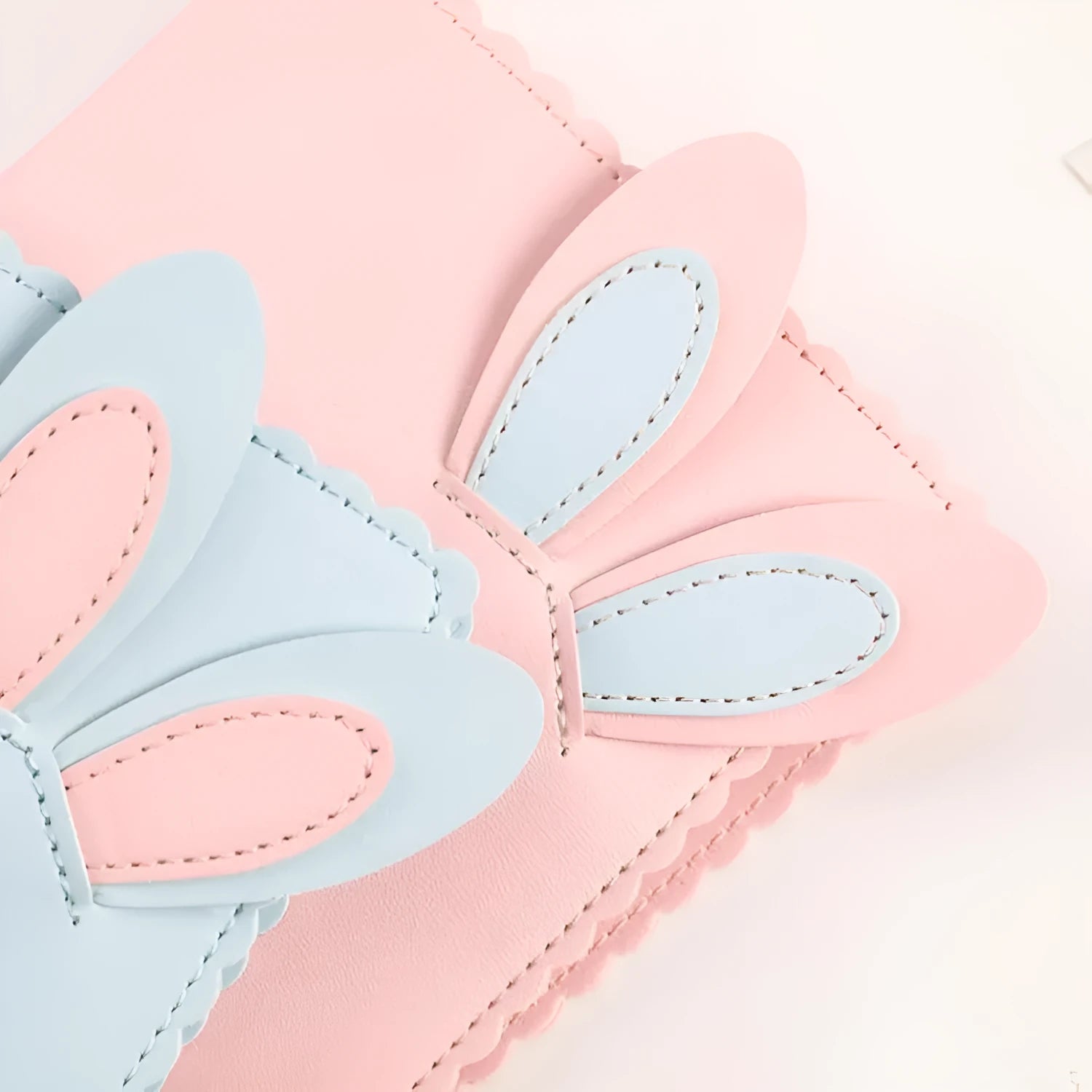 3-inch rabbit mini photo album with PU cover showing pink, blue and white colour options