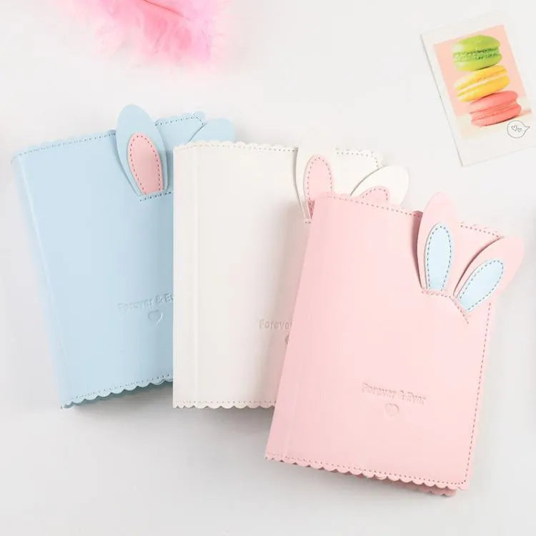 3-inch rabbit mini photo album with PU cover showing pink, blue and white colour options