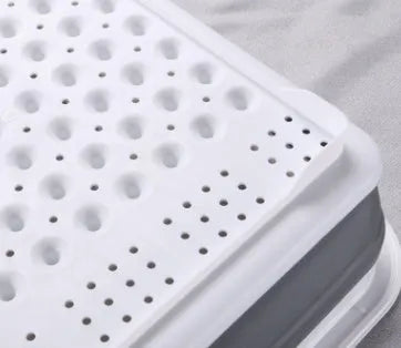 Folding off-white Japanese style dish drainer rack with porous drainage for drying tableware and vegetables