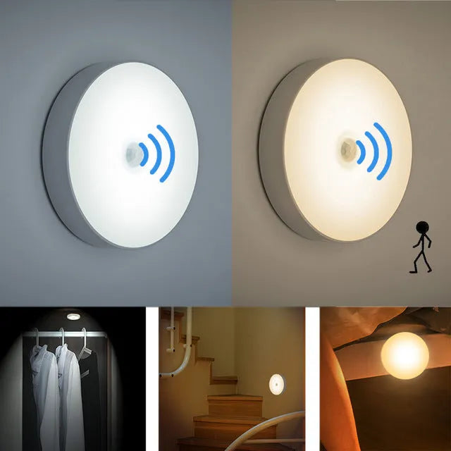 Compact round beige motion sensor LED night light with USB charging cable on a wooden surface