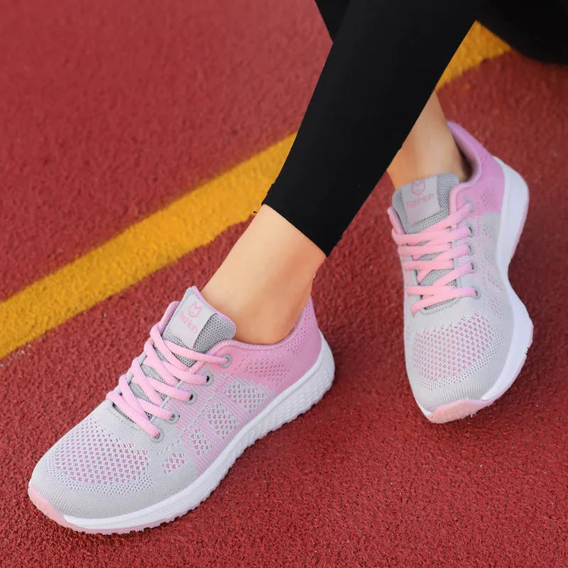 Women's flat casual shoe in white with high-top design and back lacing.
