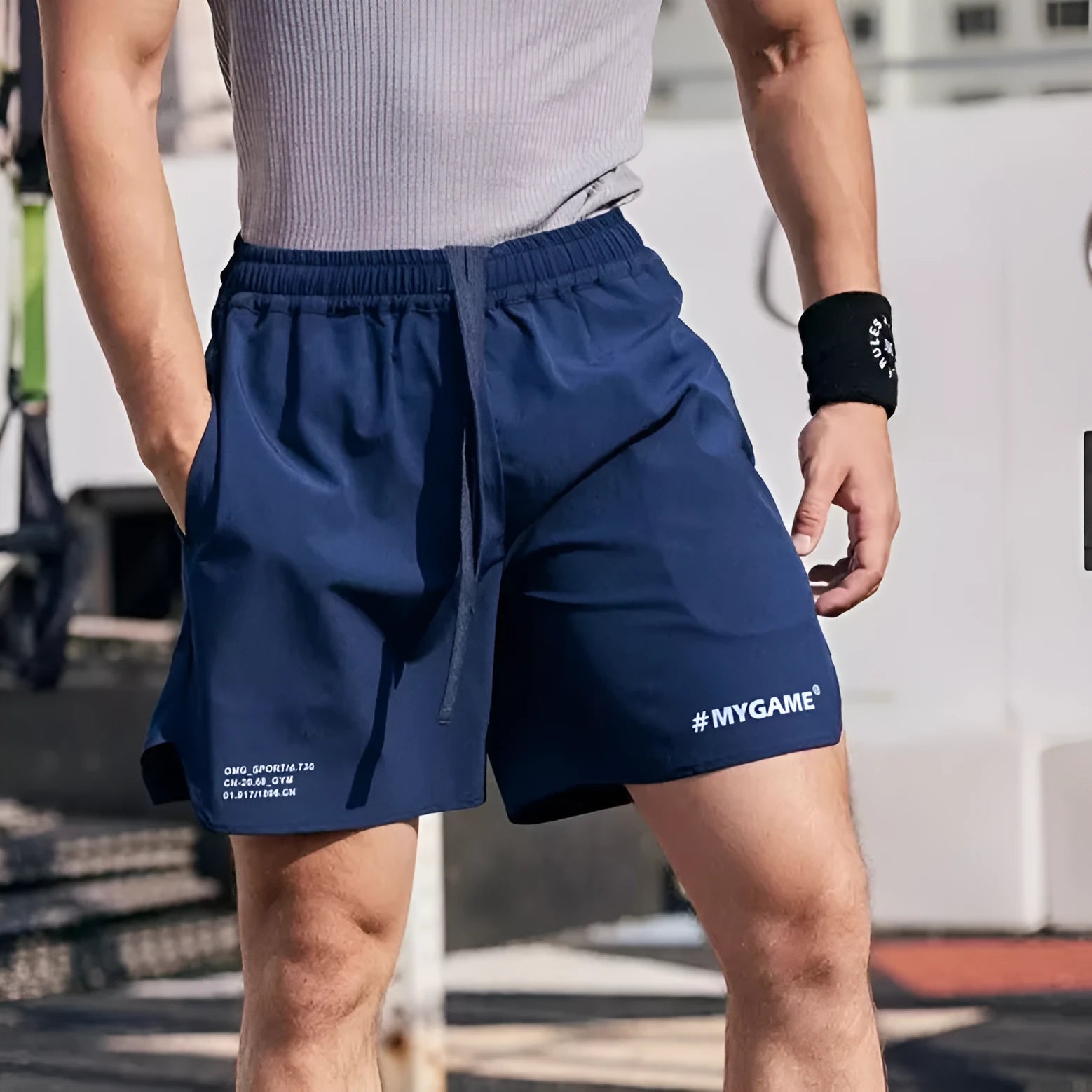 Men's grey quick-dry fitness shorts with high elasticity for gym training on a plain background.