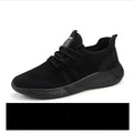 Men's black and white mesh sneakers with lace-up closure and PVC sole