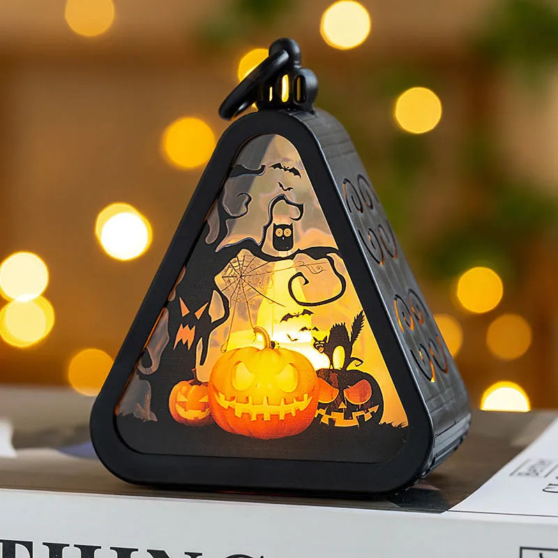 Halloween pumpkin lantern decoration in four colour designs on a table.