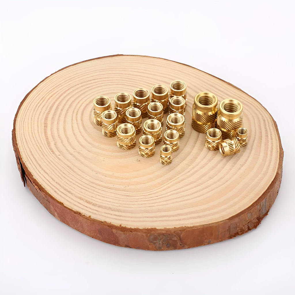 Brass hot melt copper nuts with M2 and M3 threads in various heights on a white background.