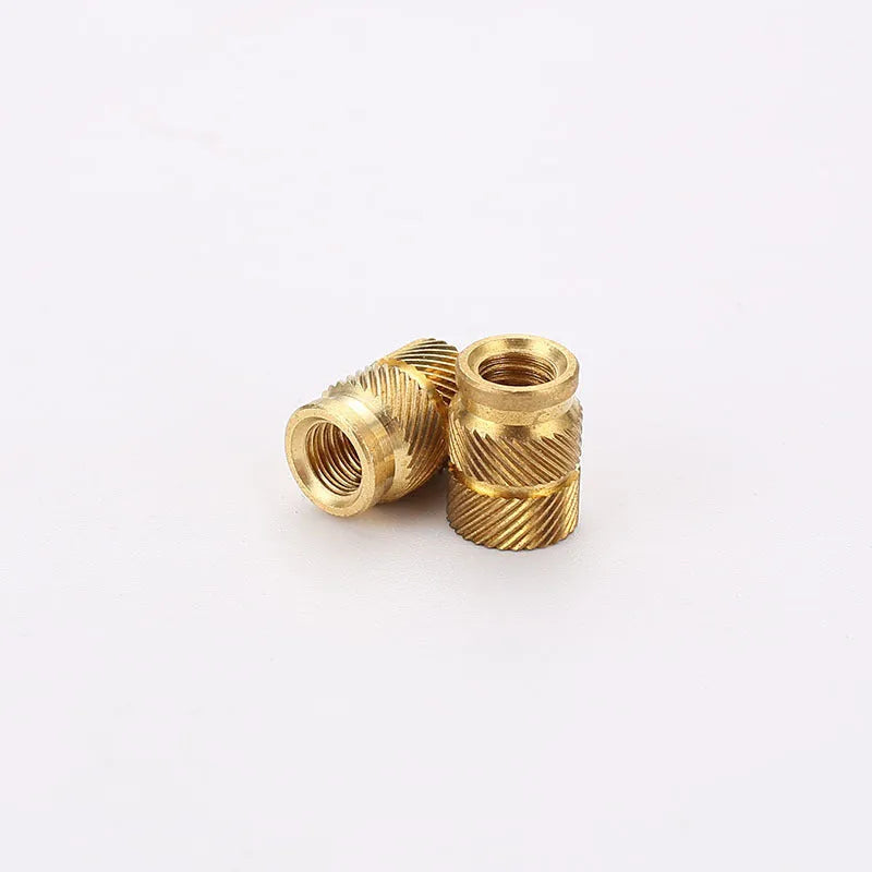 Brass hot melt copper nuts with M2 and M3 threads in various heights on a white background.