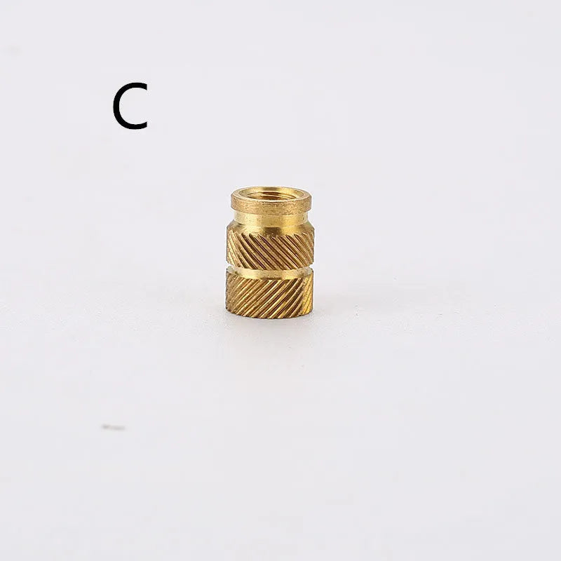 Brass hot melt copper nuts with M2 and M3 threads in various heights on a white background.