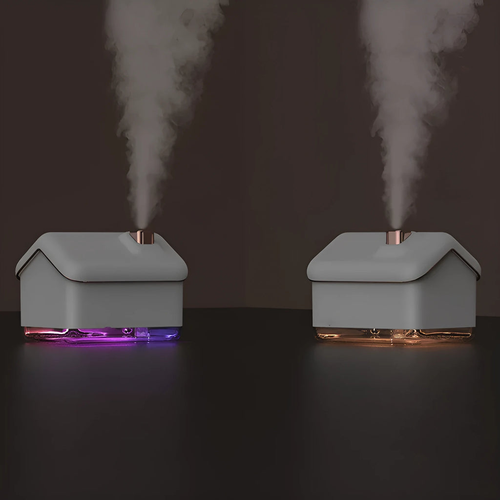 White igloo-shaped ultrasonic humidifier and essential oil diffuser with LED light and water tank.