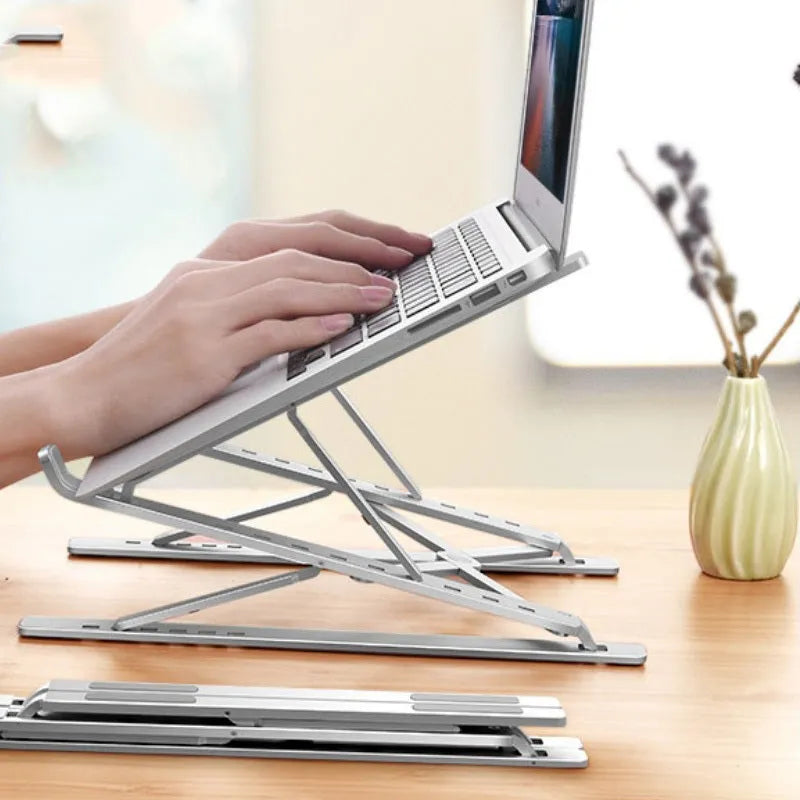 Double-layer aluminium alloy laptop stand in silver, folded with flannel bag, 80 kg load capacity