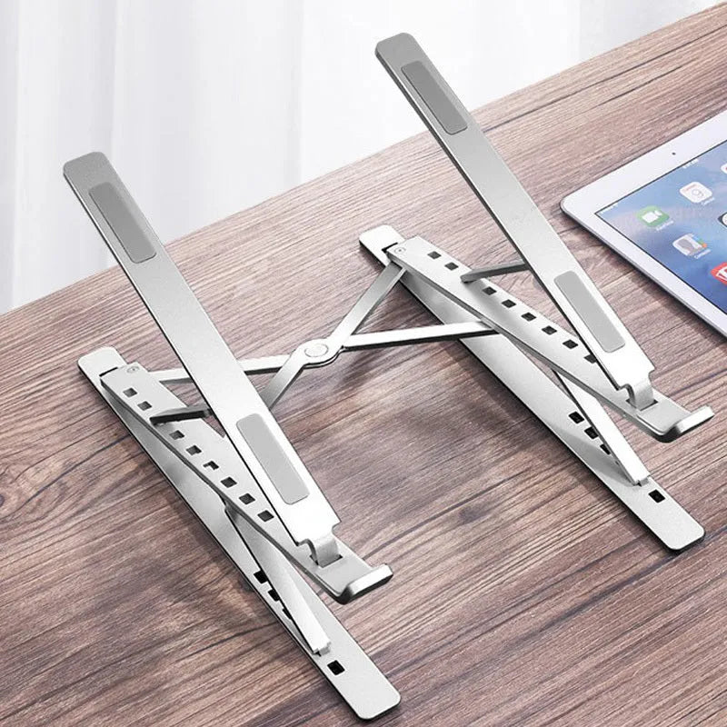 Double-layer aluminium alloy laptop stand in silver, folded with flannel bag, 80 kg load capacity