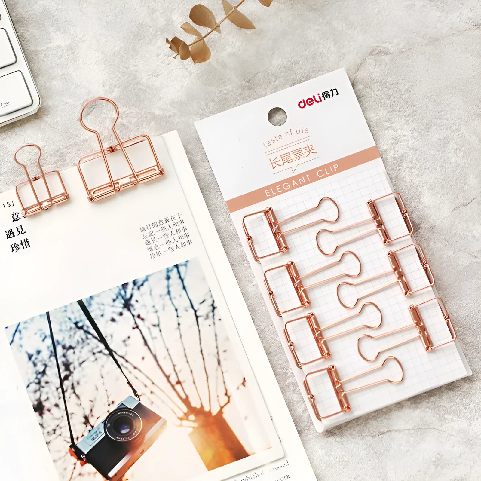 Rose gold metal binder clip set showing eight small and six large clips for document organisation