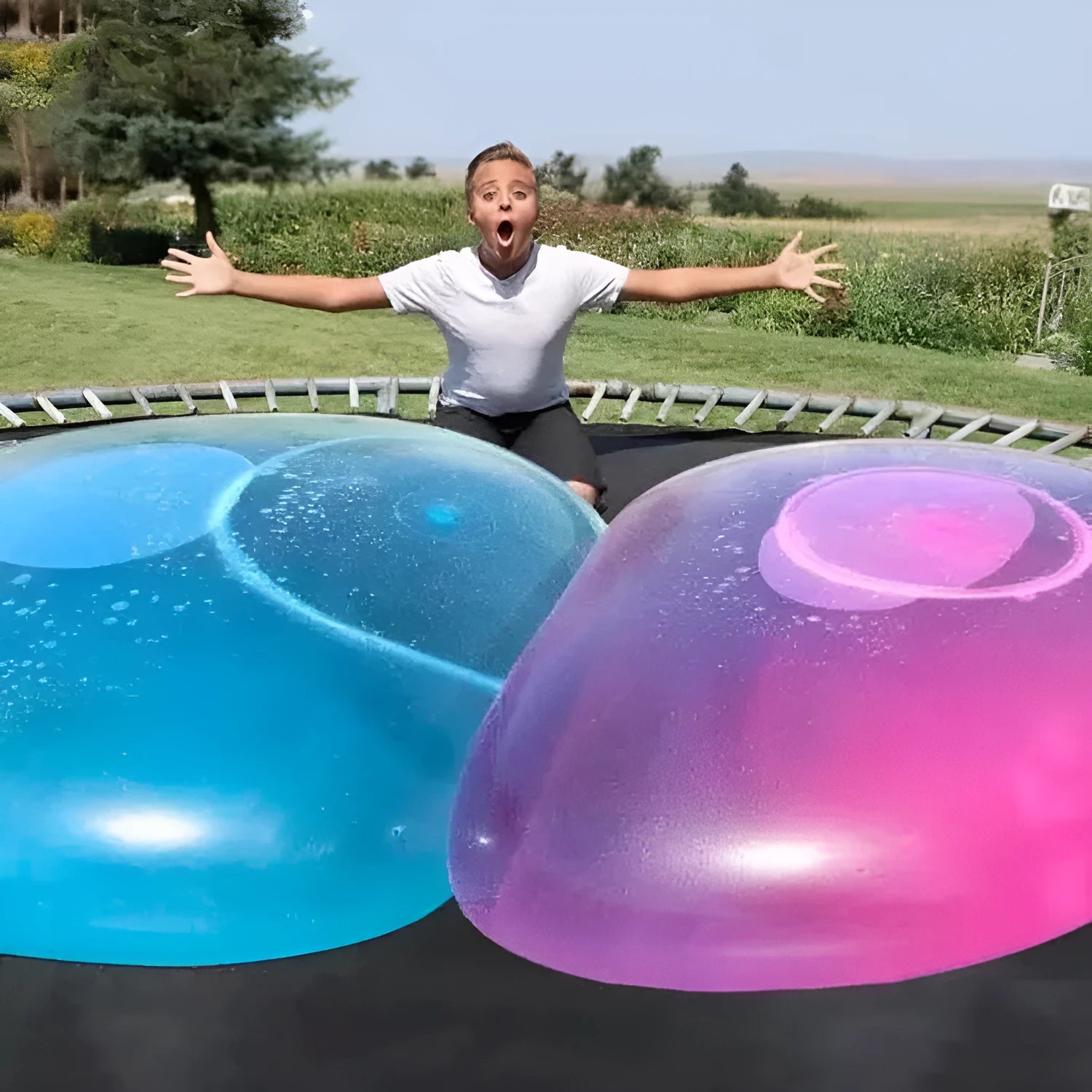 Inflatable TPR bouncy ball in pink, yellow, green, and blue colours with size options from 40 cm to 120 cm diameter