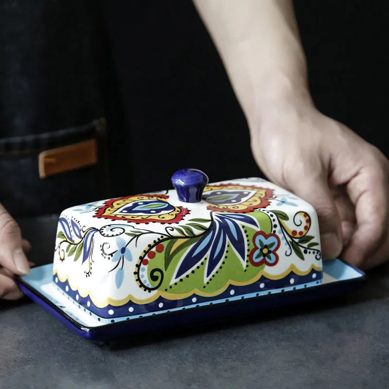 Ceramic butter box with lid showing floral pattern decoration in square European style design