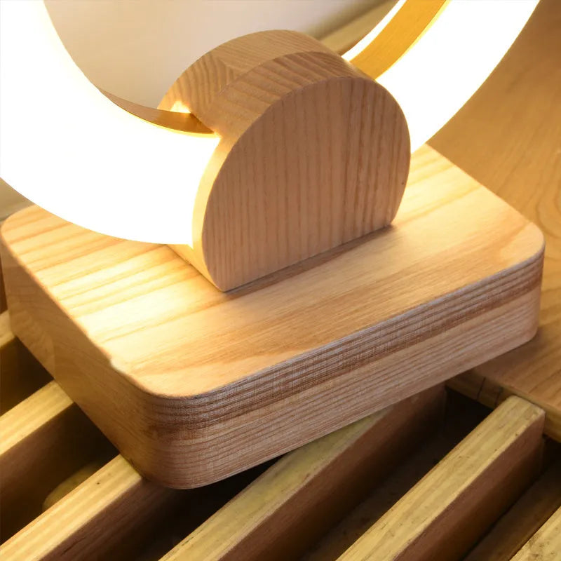 Nordic style wooden circular chandelier with acrylic shade in living room setting