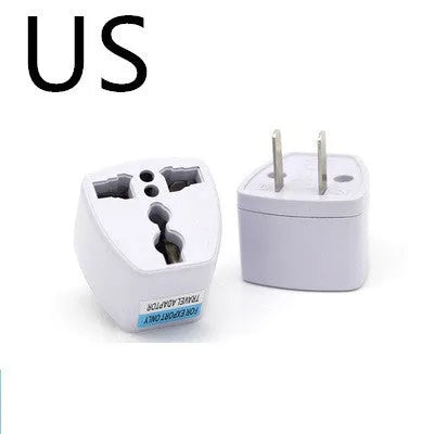 Multi country conversion plug in white with AU EU German UK and US style options on a neutral background