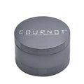 Four layer metal smoke grinder in aviation aluminium alloy with diamond teeth, shown in black, green, grey, and violet colours.