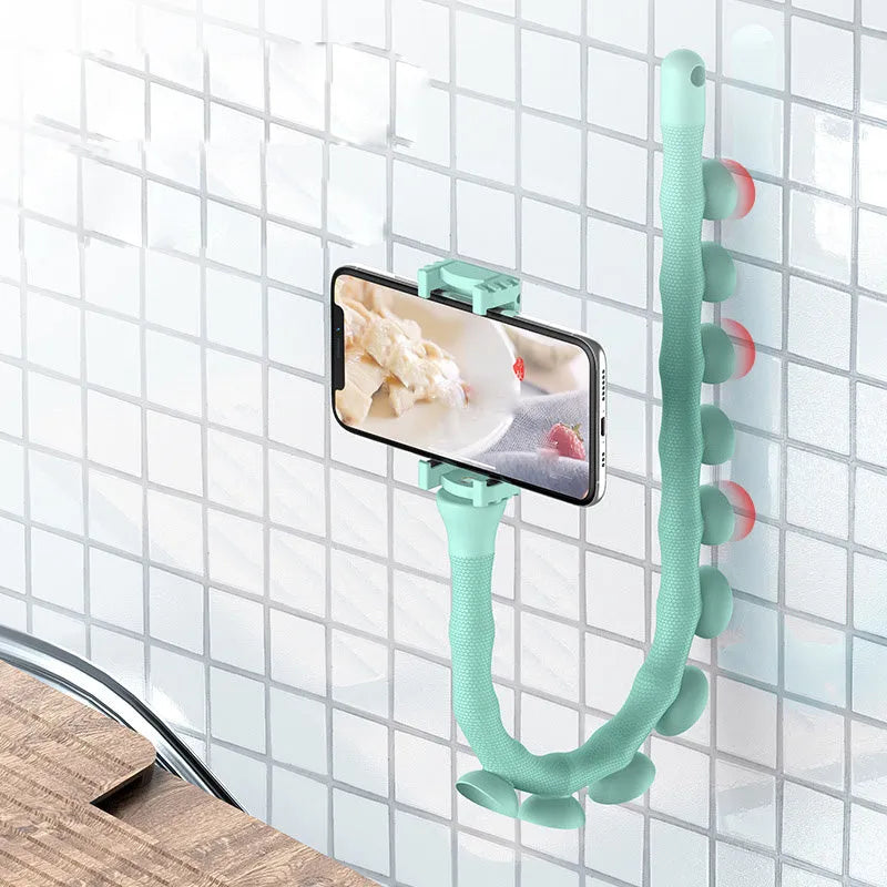 Black flexible rubber phone holder with suction cup extended to 62cm length on a desktop