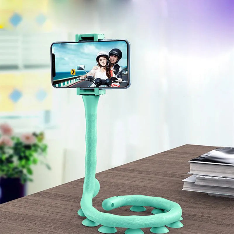 Black flexible rubber phone holder with suction cup extended to 62cm length on a desktop