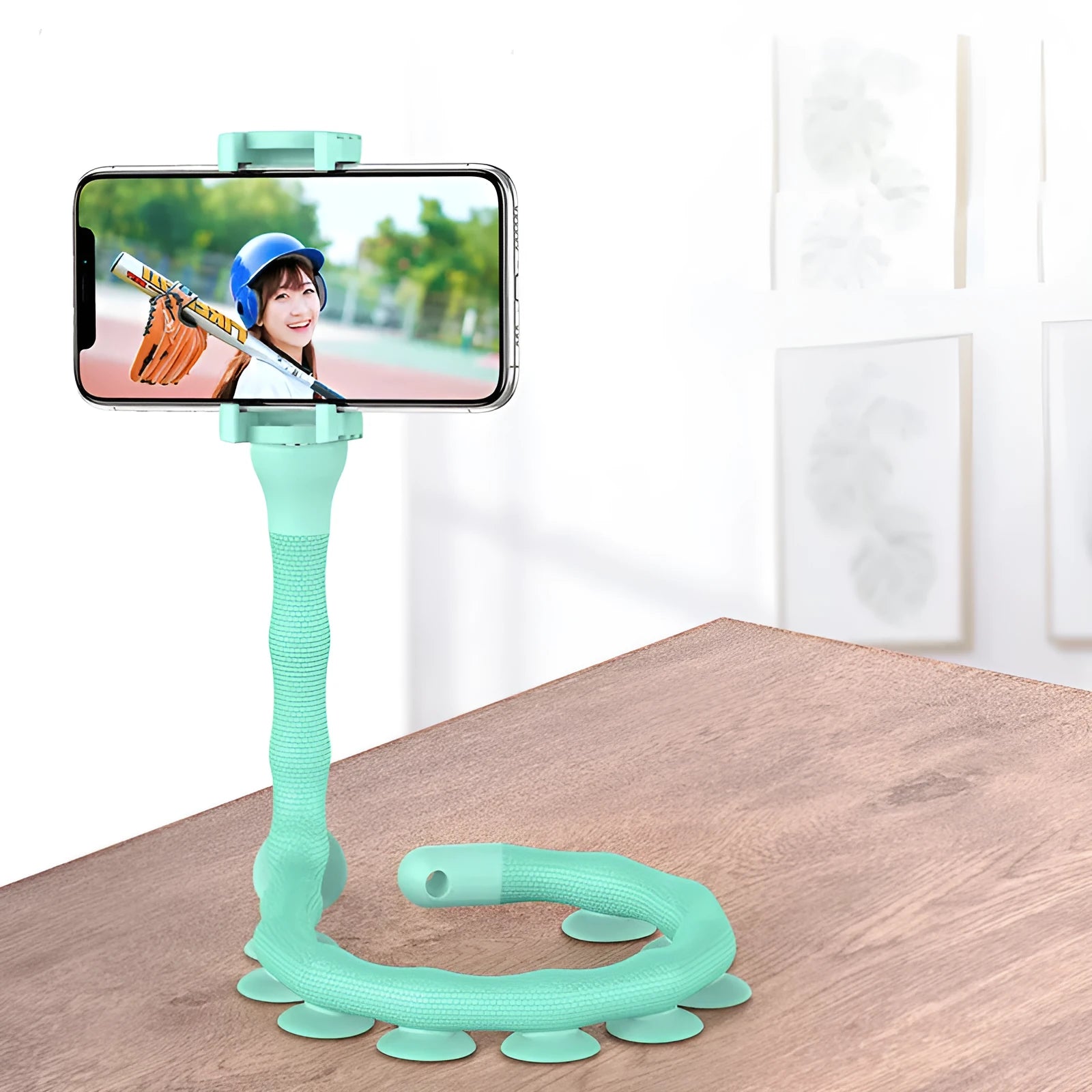 Black flexible rubber phone holder with suction cup extended to 62cm length on a desktop