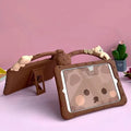 Brown cartoon-design silicone case for iPad with integrated folding stand in portrait and landscape viewing angles.
