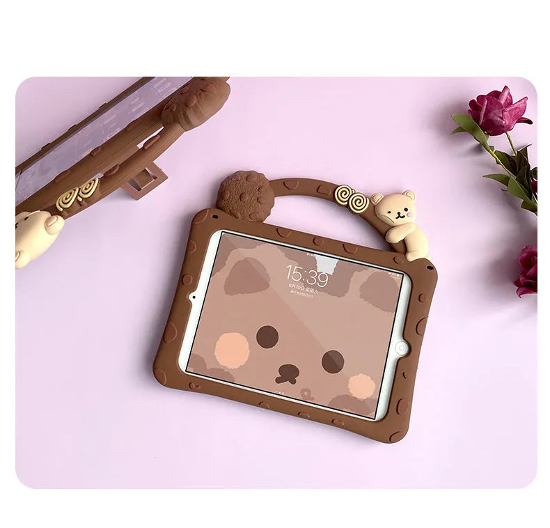 Brown cartoon-design silicone case for iPad with integrated folding stand in portrait and landscape viewing angles.