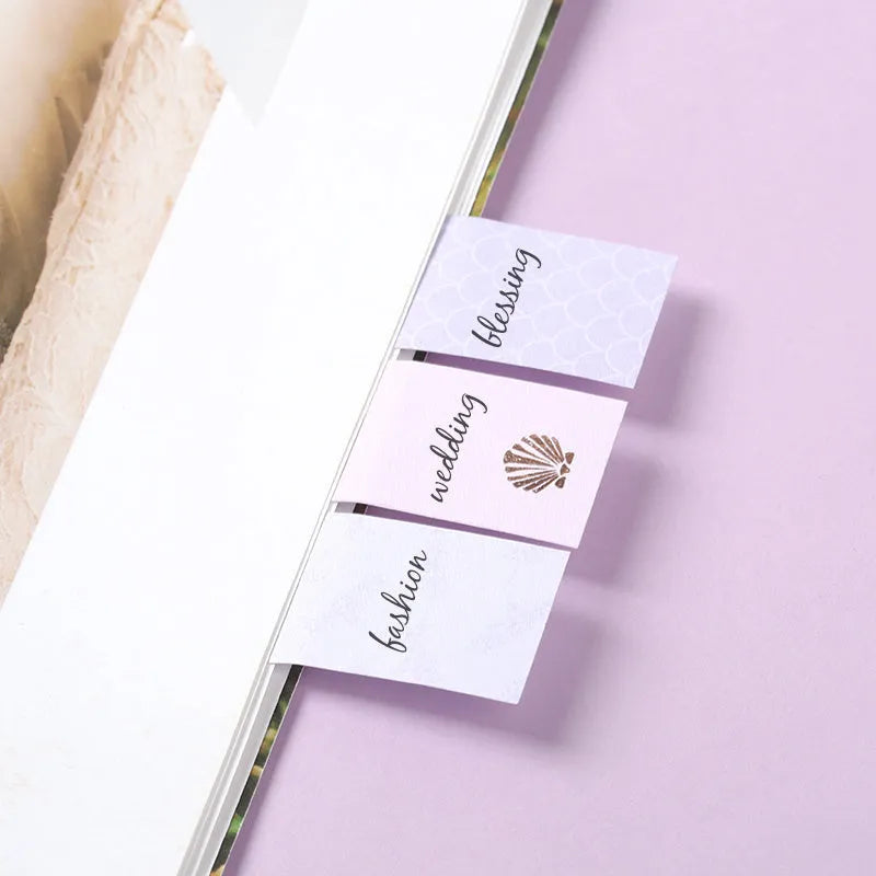 Set of six colourful self-adhesive memo pads with mermaid, leopard, and splashed ink designs.
