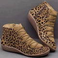 Women's casual flat booties with a wedge heel and round toe in assorted colours.