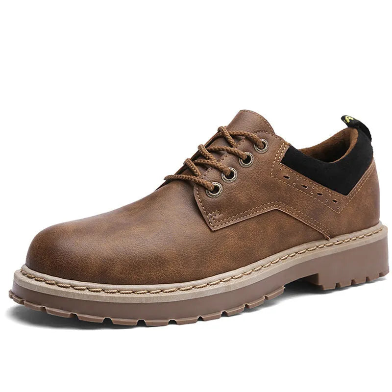 Men's black casual lace-up shoes with a round toe and flat rubber sole on a plain background.