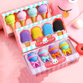 Set of 12 colourful cartoon erasers shaped like ice cream cones, lollipops, and donuts for children.