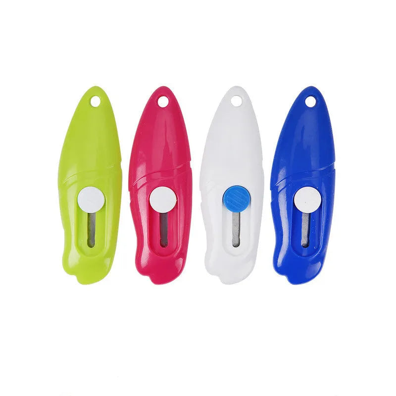 Cartoon character art knife with open box design showing plastic body and metal blade