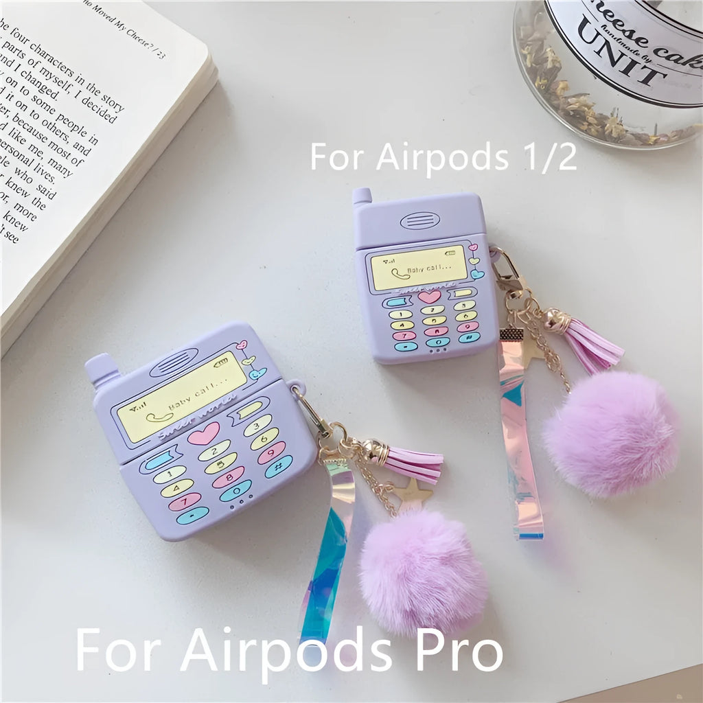Purple silicone AirPods protective case with fur ball pendant attached to clamshell design