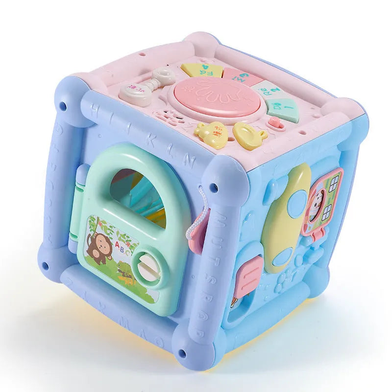 Blue baby musical hand drum toy with piano keys, geometric blocks, and easy-grip handle on white background
