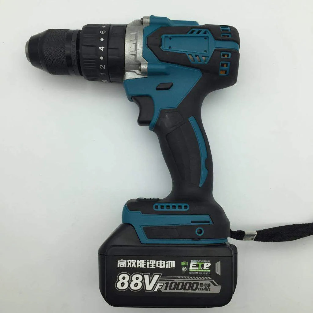 Black and yellow cordless impact drill with lithium battery on a workbench with drill bits.